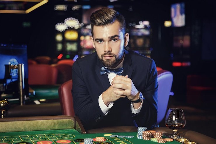 Live Sic Bo dealer studio with three dice and betting layout displayed on screen